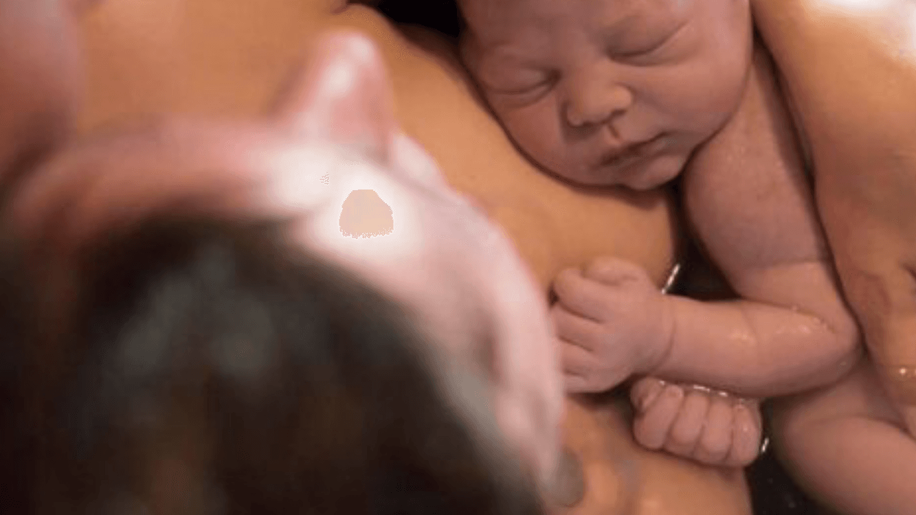 Newborn on mother’s breast