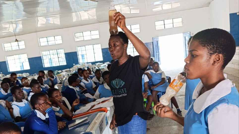 Speaking to girls at St. Louis Secondary School. 