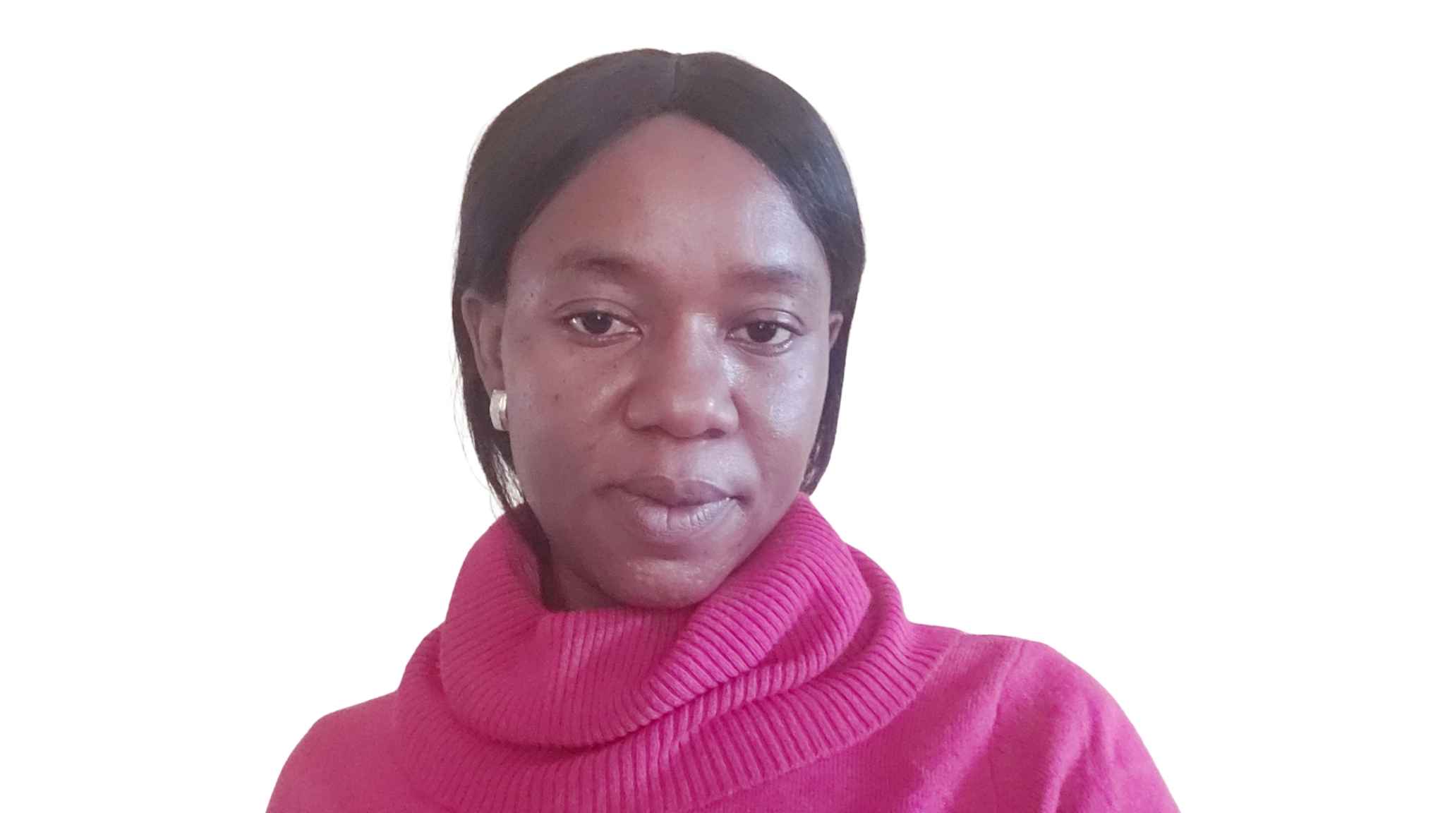 A woman with dark hair pulled back wearing a bright pink turtleneck sweater, photographed against a white background. She has a gentle expression and is wearing small earrings.