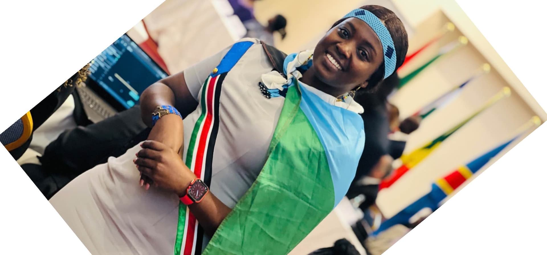 I am wearing  my country flag customized dress  with the flag on my neck and the traditional beads of my culture.       