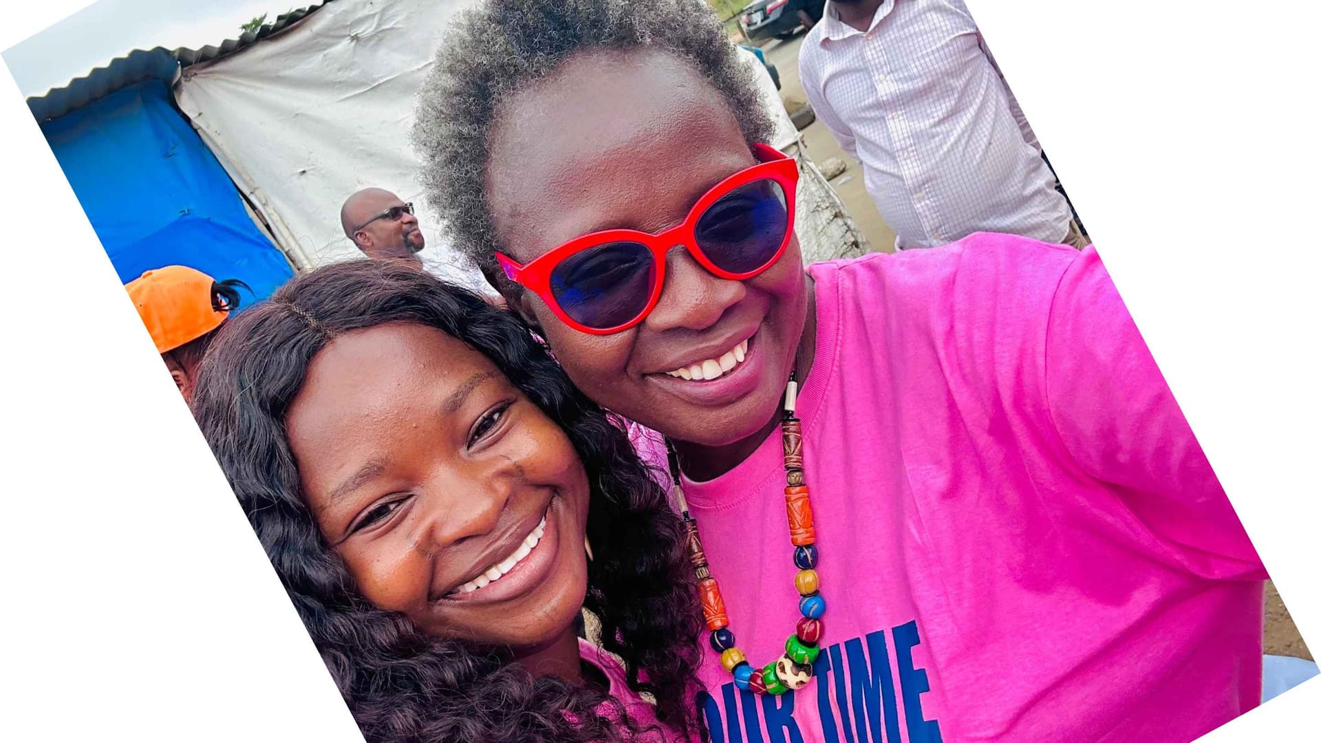 Two smiling women.