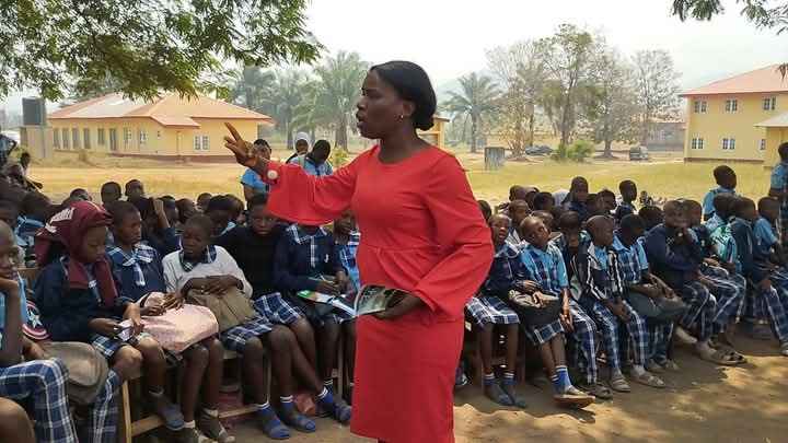 Me teaching some students during my weekly school visitation